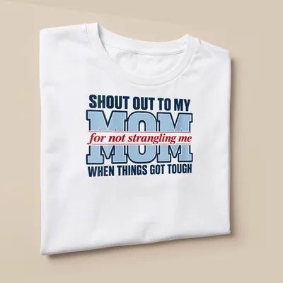 Bold typography shirt in red, blue, and white celebrating mom's patience during tough times — printed on a unisex t-shirt (angled view)