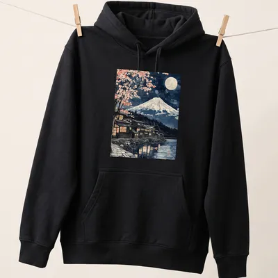 Japanese woodblock style Mount Fuji scene with sakura trees under moonlight — printed on a unisex hoodie