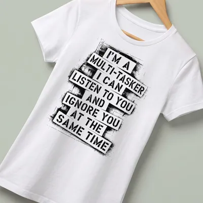Bold distressed T-shirt with humorous multitasking text in black and white — printed on a women's shirt