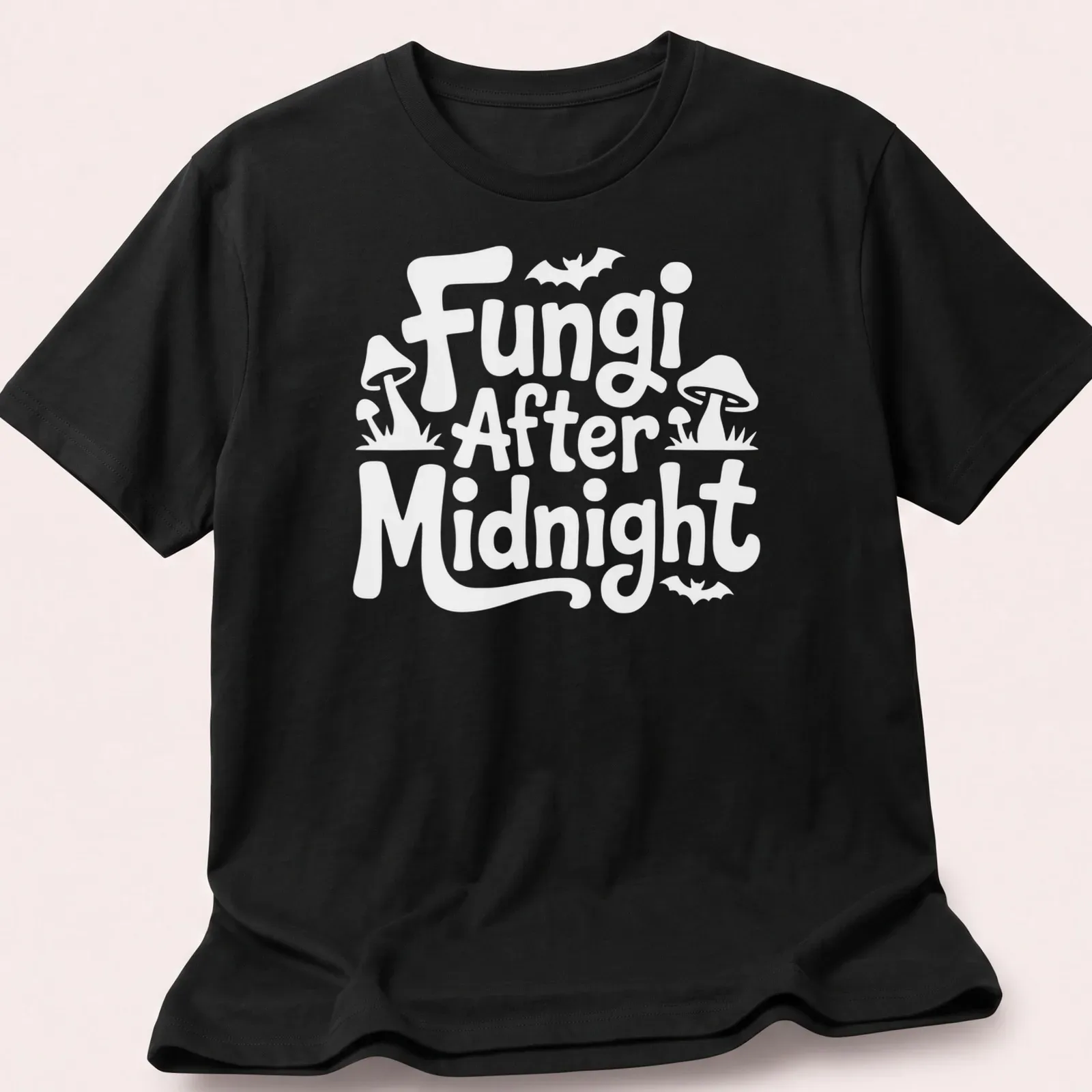 Whimsical illustration of mushrooms with 'Fungi After Midnight' text in purple, green, and blue. — printed on a unisex t-shirt