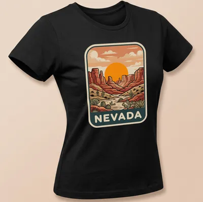 Retro print featuring a sunset over Nevada's desert canyon landscape — printed on a women's shirt