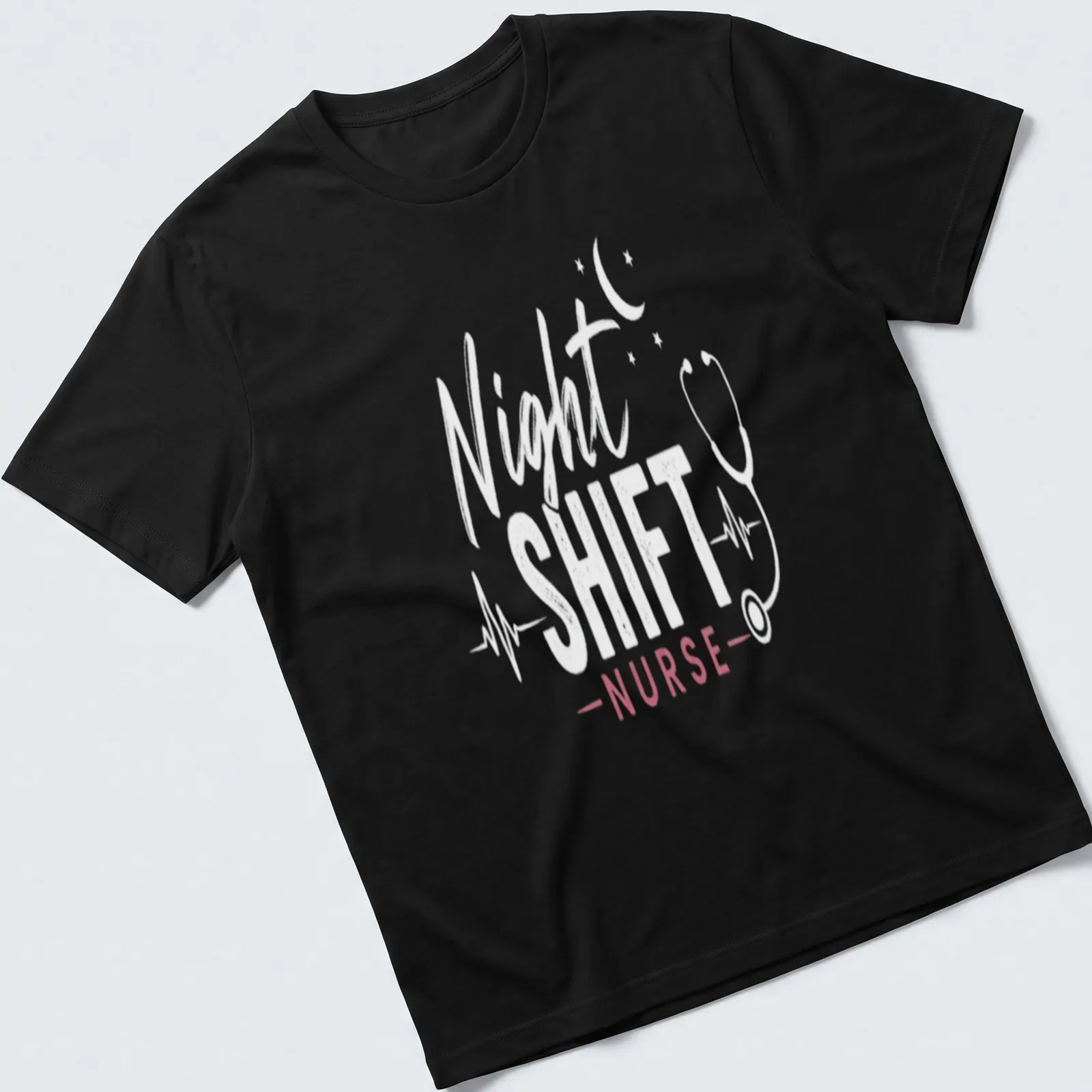 Modern typography on a shirt reading 'Night Shift Nurse' in white and pink — printed on a unisex t-shirt
