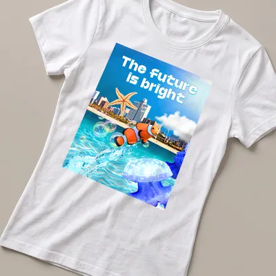 Vibrant digital art of ocean scene with clownfish and starfish and bright text — printed on a women's shirt