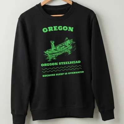 Vintage illustration of anglers on a fishing boat with text about Oregon steelhead fishing — printed on a unisex sweatshirt