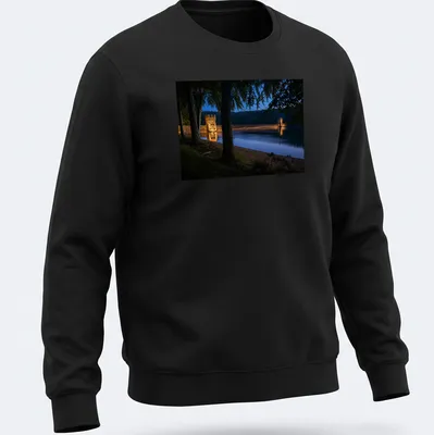 Photographic T-shirt featuring Derwent Dam illuminated at twilight in blue and gold — printed on a unisex sweatshirt