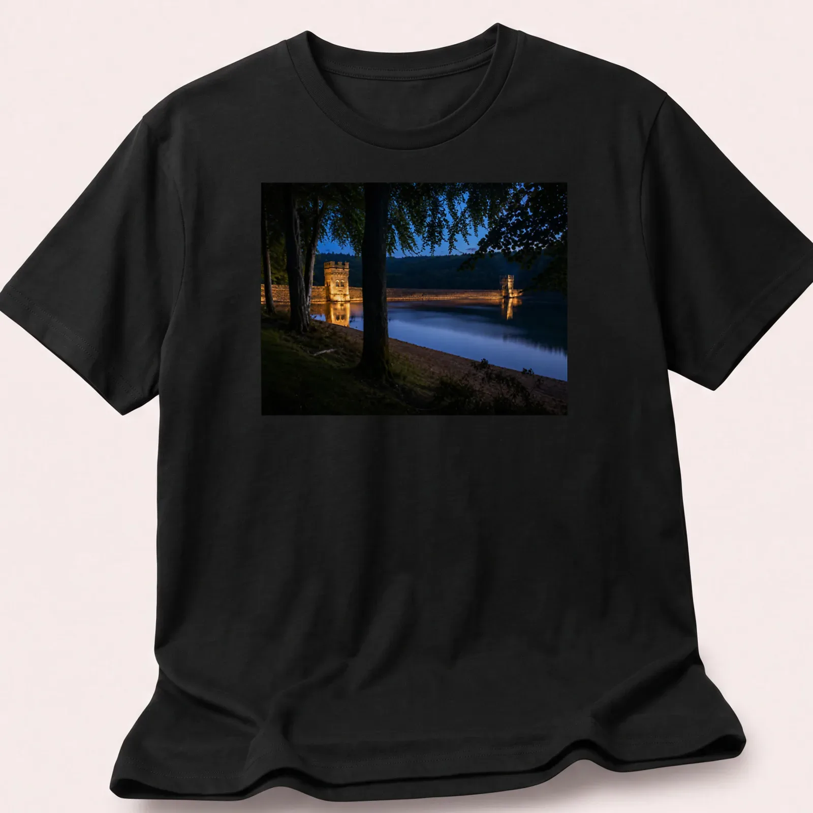 Photographic T-shirt featuring Derwent Dam illuminated at twilight in blue and gold — printed on a unisex t-shirt