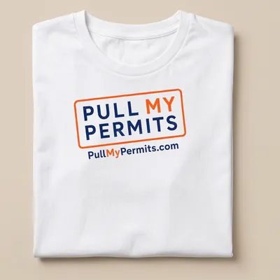 Bold typography shirt with 'Pull My Permits' text in orange and navy blue — printed on a unisex t-shirt
