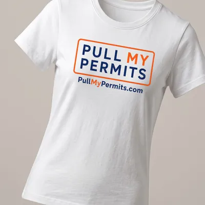 Bold typography shirt with 'Pull My Permits' text in orange and navy blue — printed on a women's shirt