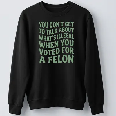 Bold political commentary t-shirt with playful typography in green and white — printed on a unisex sweatshirt