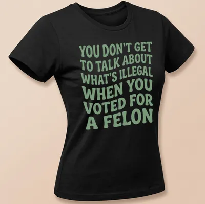Bold political commentary t-shirt with playful typography in green and white — printed on a women's shirt