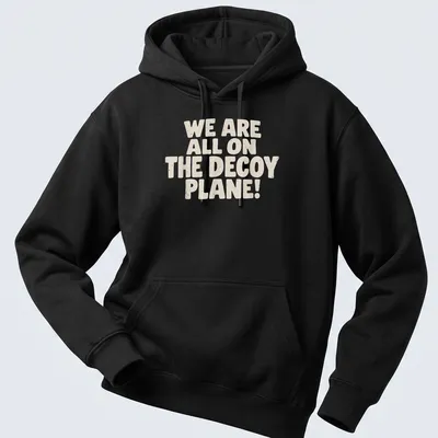 Bold typography t-shirt with the phrase 'We Are All On The Decoy Plane!' in beige and cream. — printed on a unisex hoodie