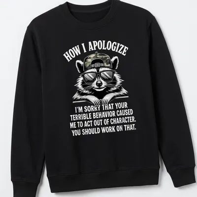 Bold cartoon print featuring a raccoon and humorous apology text — printed on a unisex sweatshirt