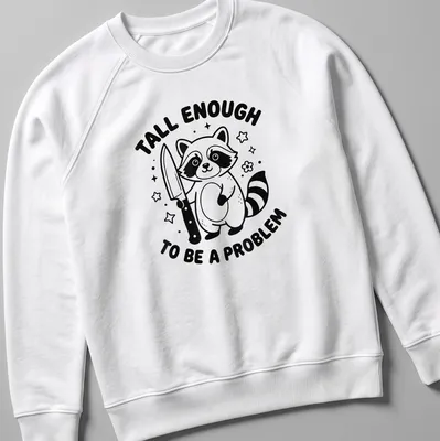 Kawaii line-art t-shirt featuring a raccoon and the text 'Tall Enough To Be A Problem' — printed on a unisex sweatshirt
