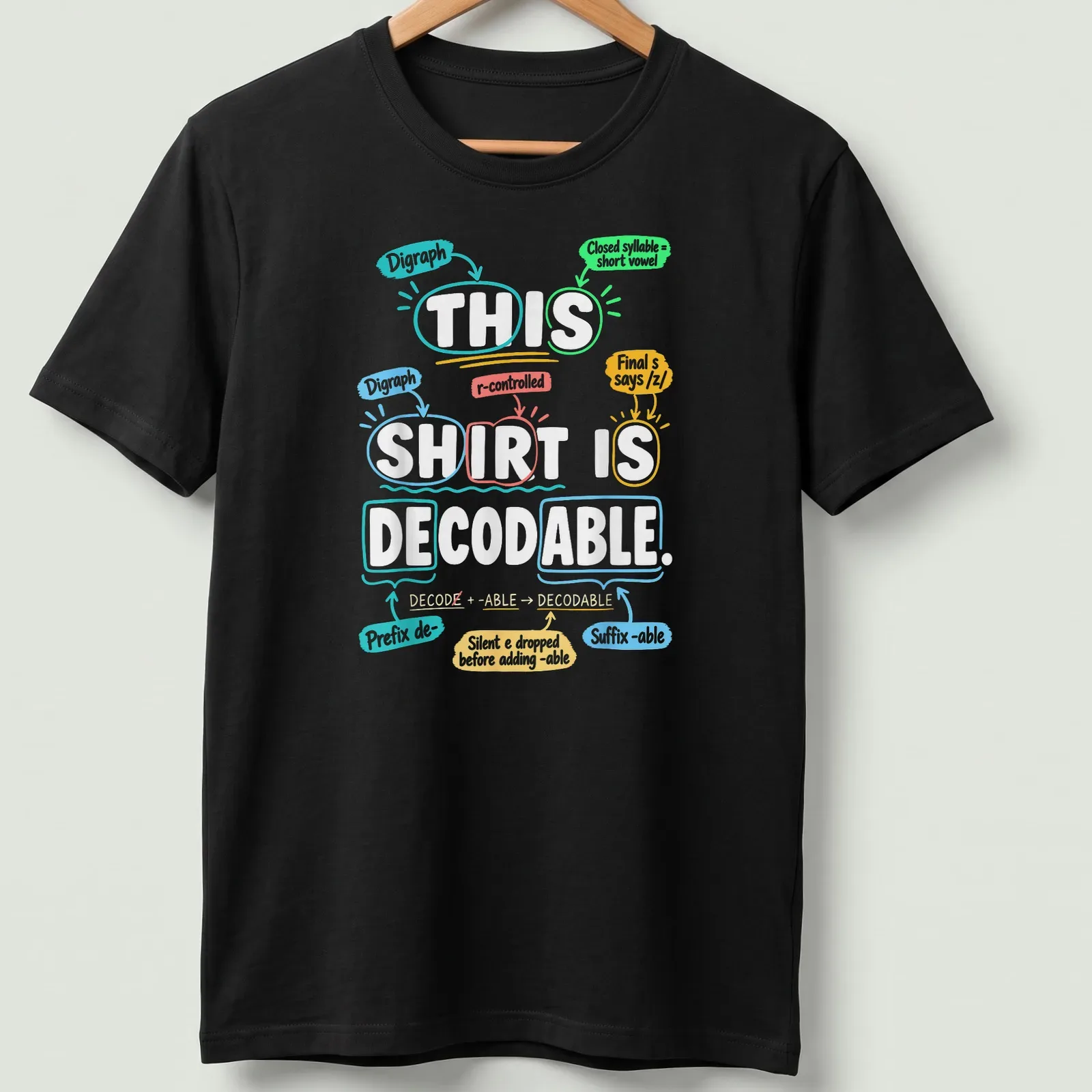 Decodable shirt for teachers, featuring colorful text promoting literacy — printed on a unisex t-shirt