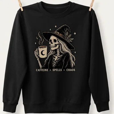 Vintage illustration of a skeleton witch with a coffee mug and the text Caffeine Spells Chaos — printed on a unisex sweatshirt