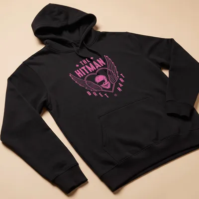 Retro distressed shirt featuring a skull with wings and Bret Hart's name in pink and white — printed on a unisex hoodie