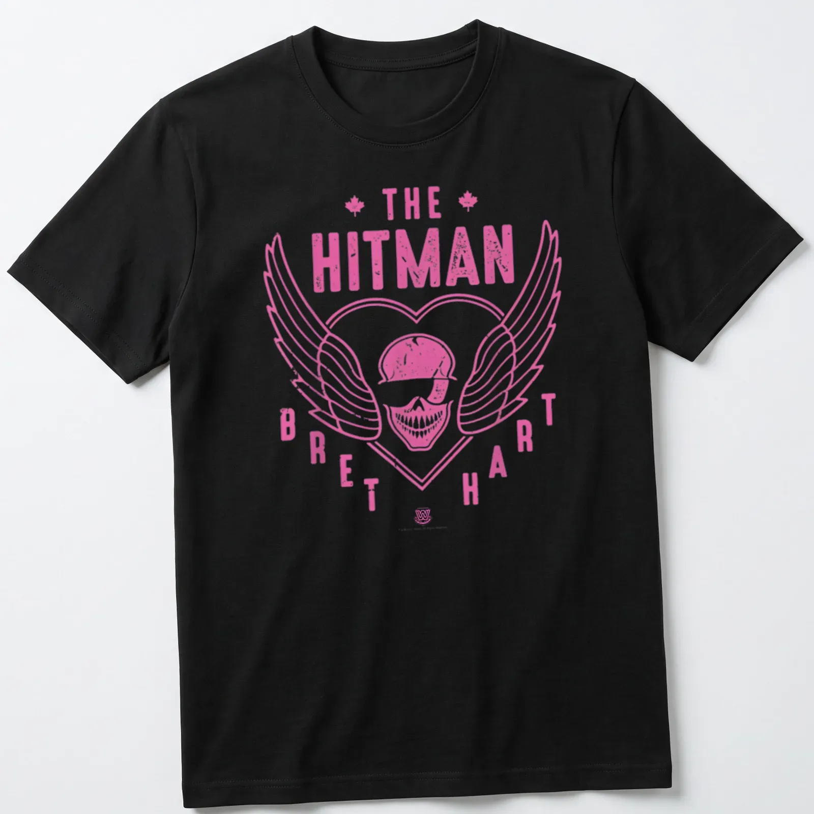 Retro distressed shirt featuring a skull with wings and Bret Hart's name in pink and white — printed on a unisex t-shirt