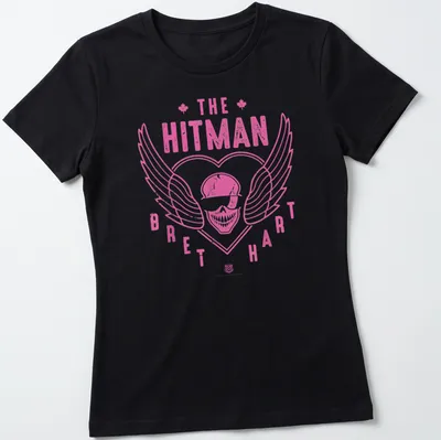 Retro distressed shirt featuring a skull with wings and Bret Hart's name in pink and white — printed on a women's shirt