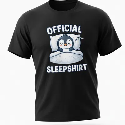 Kawaii cartoon of a sleeping penguin with the text 'Official Sleepshirt' above. — printed on a unisex t-shirt