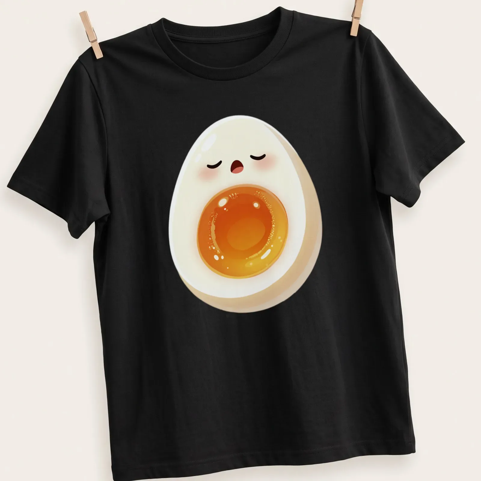 Kawaii sleepy egg graphic featuring a yolk face in white, yellow, and orange — printed on a unisex t-shirt