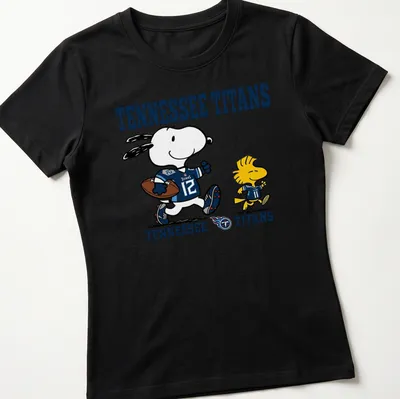Cartoon Snoopy and Woodstock on Tennessee Titans football t-shirt in blue, white, and yellow — printed on a women's shirt