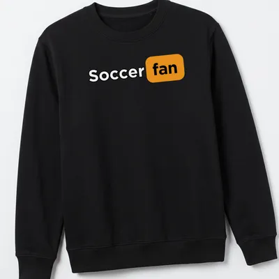 Bold modern typography shirt featuring the words Soccer Fan in black, orange, and white. — printed on a unisex sweatshirt