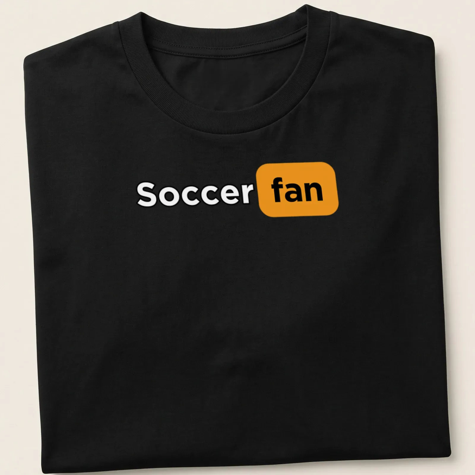 Bold modern typography shirt featuring the words Soccer Fan in black, orange, and white. — printed on a unisex t-shirt