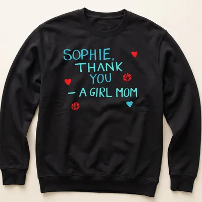 Playful t-shirt with basketball graphics and colorful text celebrating girl moms — printed on a unisex sweatshirt
