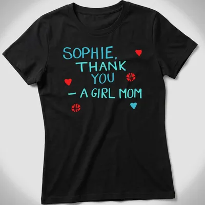 Playful t-shirt with basketball graphics and colorful text celebrating girl moms — printed on a women's shirt