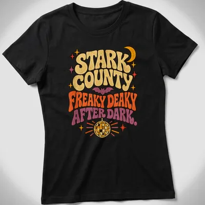 Retro design of a bat under a disco ball with vibrant colors and playful text. — printed on a women's shirt
