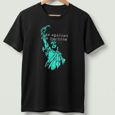 Vintage-style tee featuring the Statue of Liberty with Rage Against the Machine text in turquoise and black — printed on a unisex t-shirt