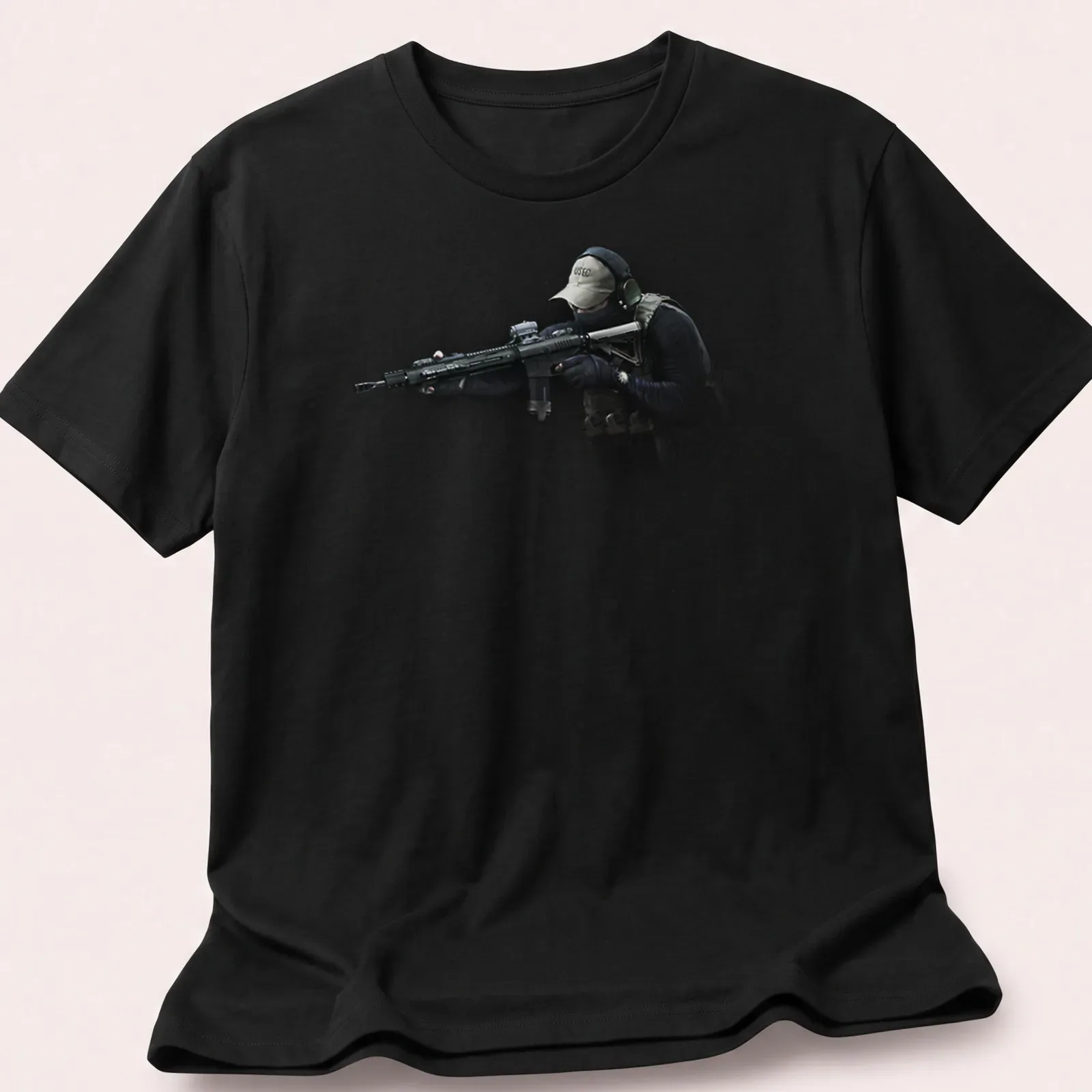 Realistic print of a tactical soldier with a rifle in black, green, tan, and gray — printed on a unisex t-shirt