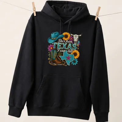 Vintage western T-shirt with Texas-themed cowgirl design and colorful text — printed on a unisex hoodie