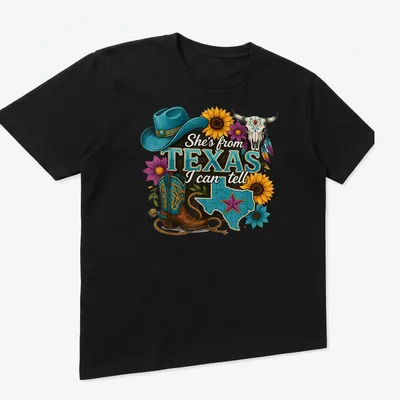Vintage western T-shirt with Texas-themed cowgirl design and colorful text — printed on a unisex t-shirt (angled view)
