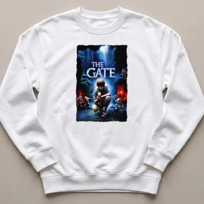 Horror movie poster-style t-shirt featuring a boy with a flashlight and the text 'THE GATE' — printed on a unisex sweatshirt