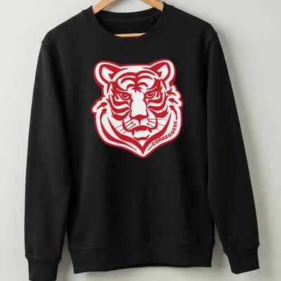 Bold graphic Correggese logo with a fierce tiger head illustration — printed on a unisex sweatshirt