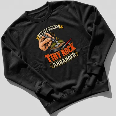 Vintage illustration shirt featuring a hand arranging rocks with tweezers — printed on a unisex sweatshirt