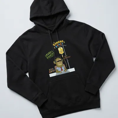 Cartoon-style T-shirt featuring a tired monkey office worker with humorous text about energizing banana juice. — printed on a unisex hoodie