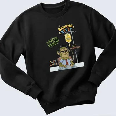 Cartoon-style T-shirt featuring a tired monkey office worker with humorous text about energizing banana juice. — printed on a unisex sweatshirt