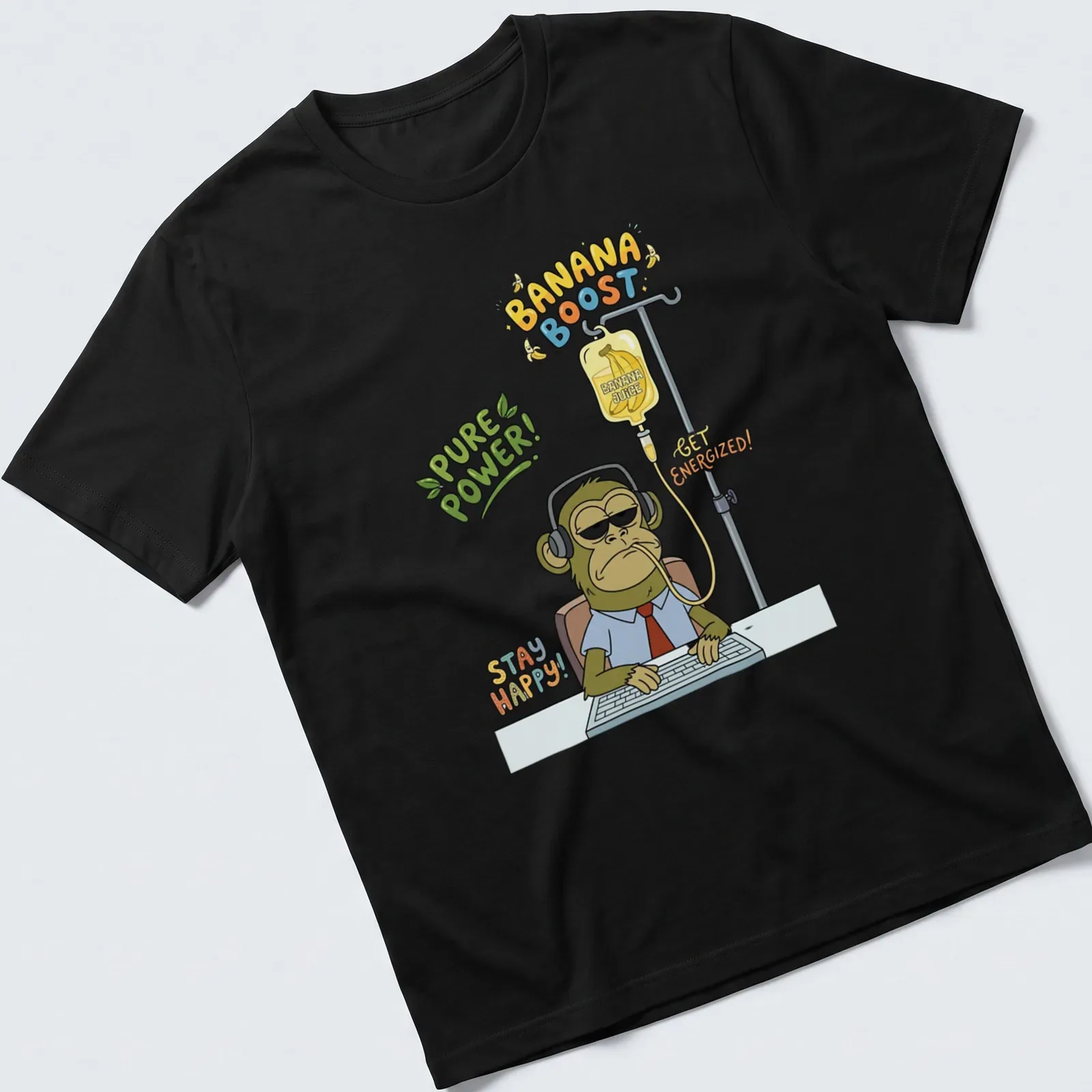Cartoon-style T-shirt featuring a tired monkey office worker with humorous text about energizing banana juice. — printed on a unisex t-shirt