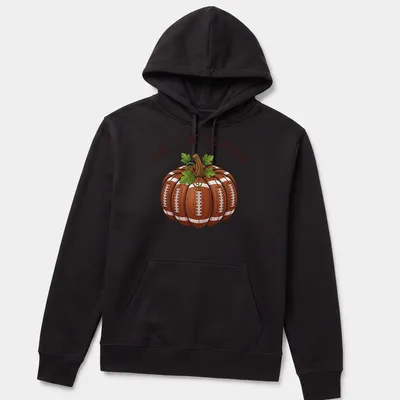 Cartoon pumpkin with footballs and the text 'TIS THE SEASON' in festive colors — printed on a unisex hoodie