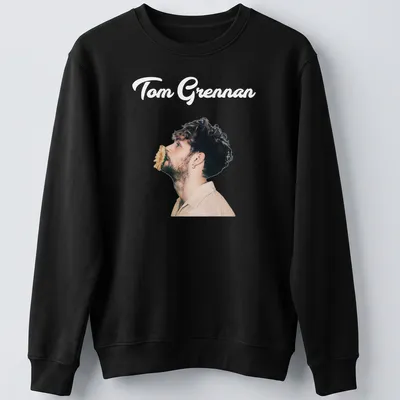 Illustration of Tom Grennan in modern portrait style with text in black, beige, and brown. — printed on a unisex sweatshirt