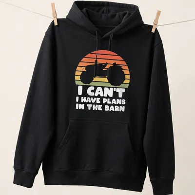 Retro distressed t-shirt featuring tractor silhouette and humorous text about barn plans — printed on a unisex hoodie