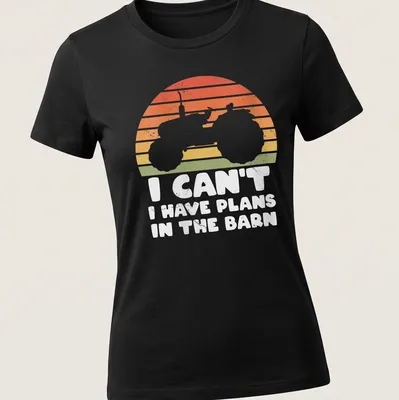 Retro distressed t-shirt featuring tractor silhouette and humorous text about barn plans — printed on a women's shirt