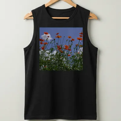 Photographic print of vibrant orange wildflowers against a blue sky — printed on a tank top