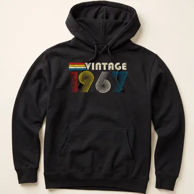 Distressed t-shirt with 'Vintage 1967' text in red, yellow, blue, and cream — printed on a unisex hoodie