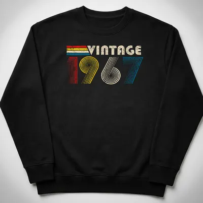 Distressed t-shirt with 'Vintage 1967' text in red, yellow, blue, and cream — printed on a unisex sweatshirt
