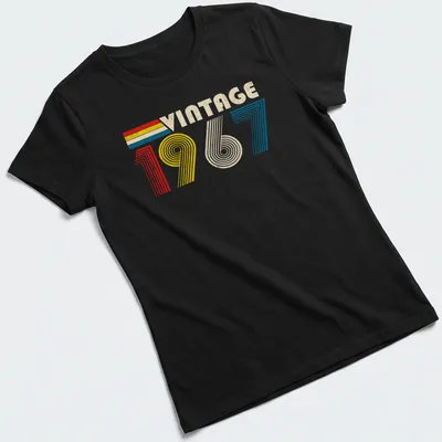Distressed t-shirt with 'Vintage 1967' text in red, yellow, blue, and cream — printed on a women's shirt