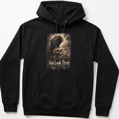 Vintage distressed design with a sarcastic vulture and the text You Look Tired — printed on a unisex hoodie