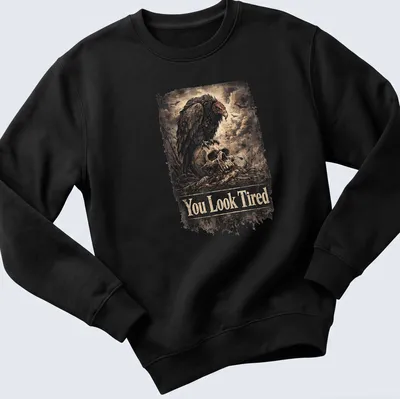 Vintage distressed design with a sarcastic vulture and the text You Look Tired — printed on a unisex sweatshirt